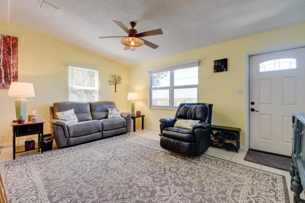 a living room with furniture and a window