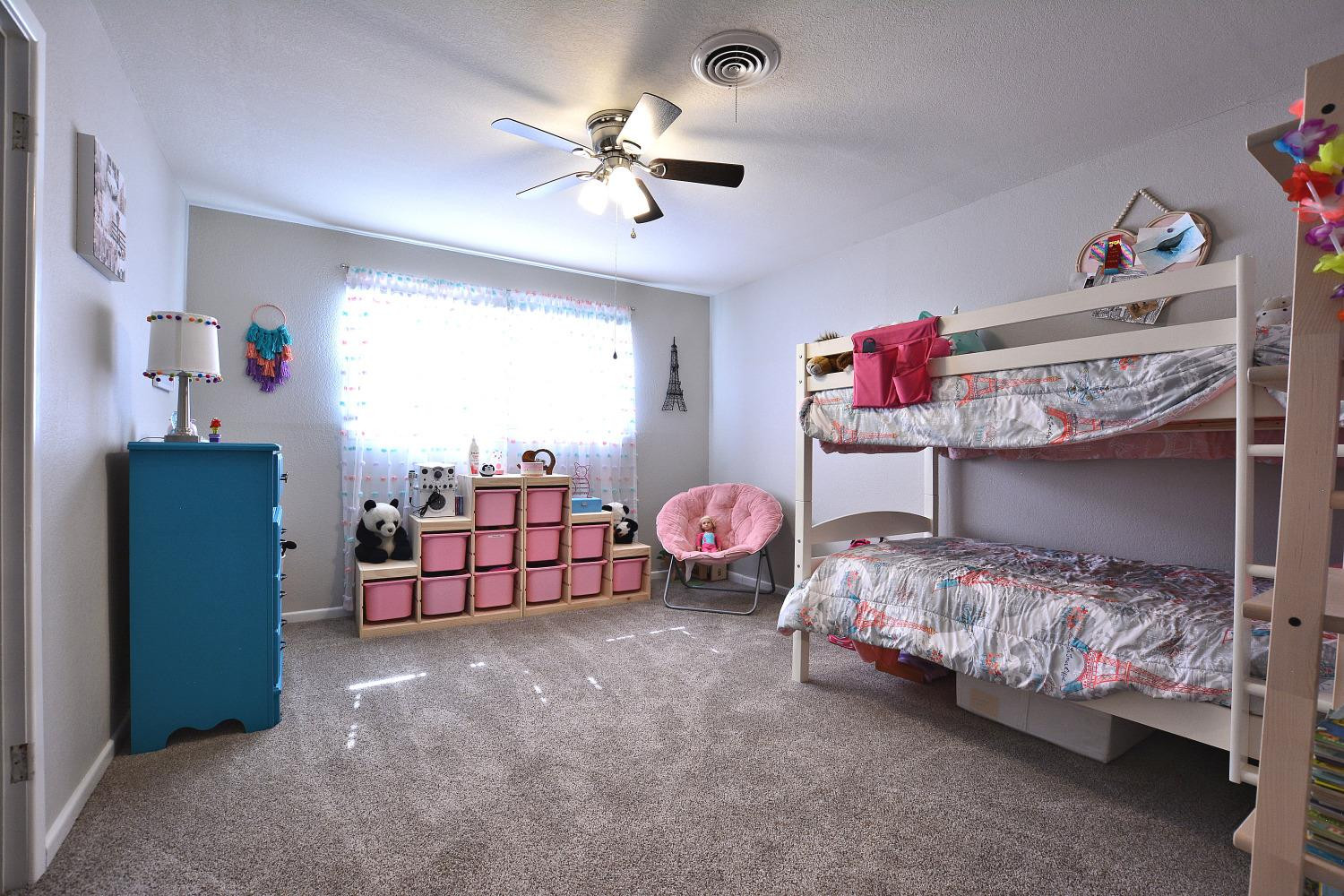 4903 17th Street Lubbock, TX 79416 - Photo 19 of 25 a bedroom with two beds and painted walls