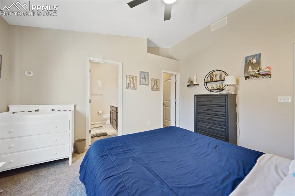 1546 York Road Colorado Springs, CO 80920 - Photo 11 of 23 a bedroom with a bed and a cabinets