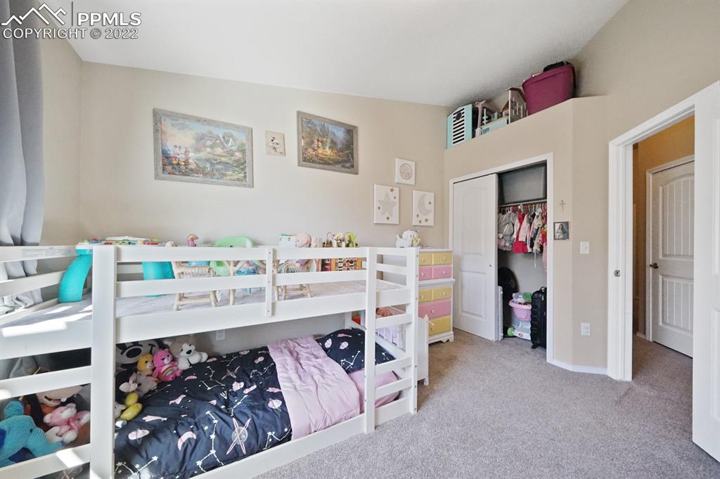 1546 York Road Colorado Springs, CO 80920 - Photo 15 of 23 a bed room with a bed and a couch