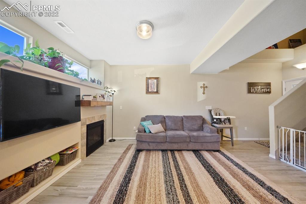 1546 York Road Colorado Springs, CO 80920 - Photo 8 of 23 a living room with furniture and a flat screen tv
