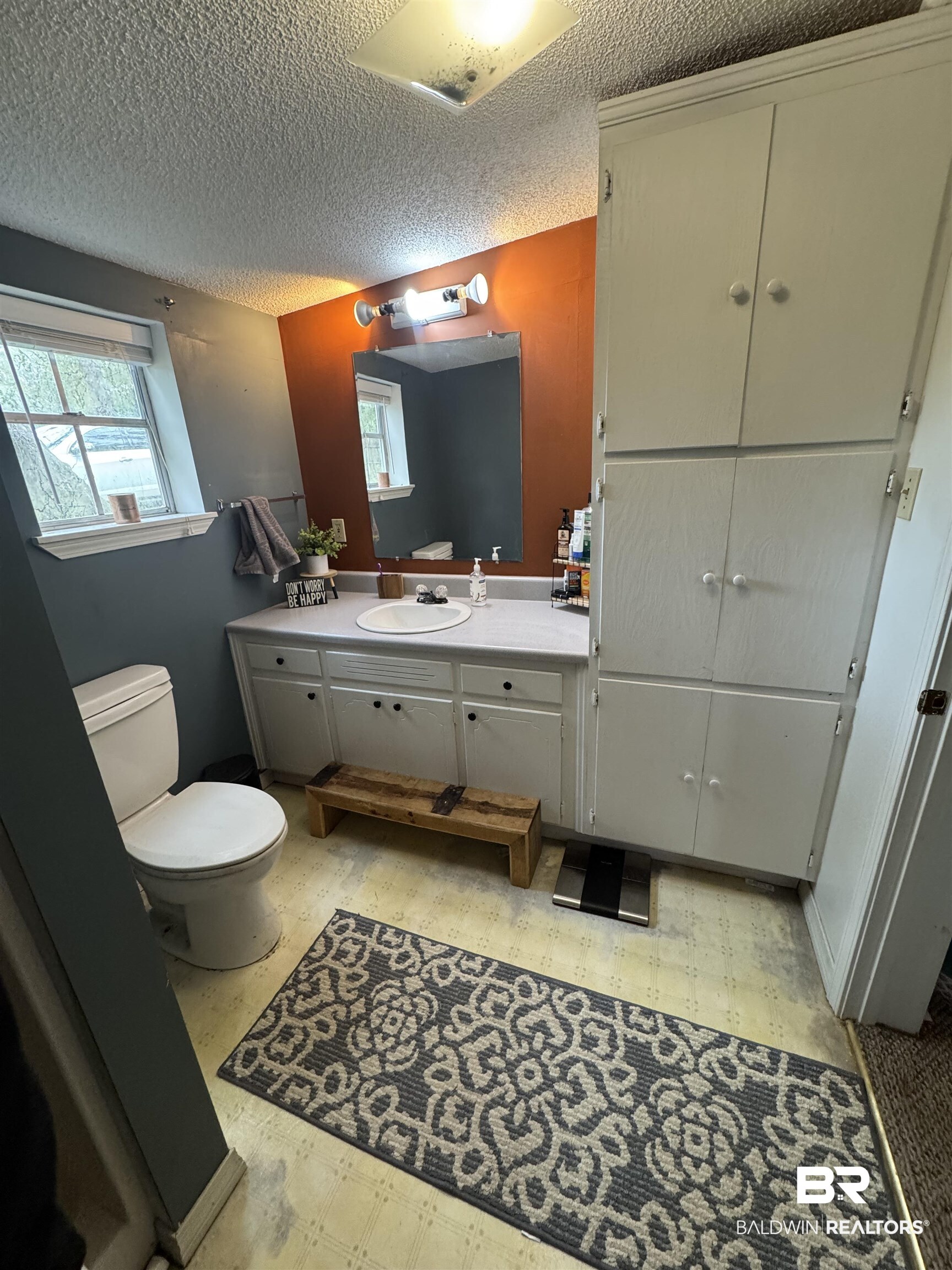 406 Cleveland Road Saraland, AL 36571 - Photo 7 of 16 Bathroom with vanity, a textured ceiling, and toilet