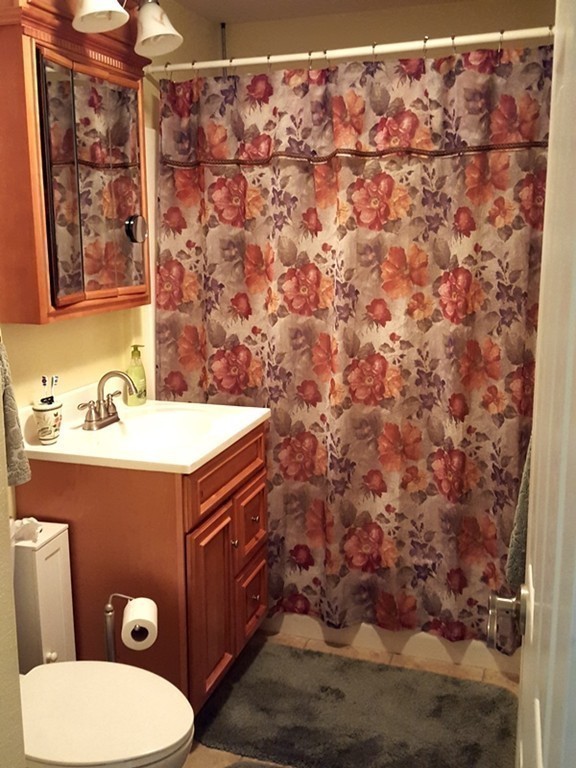 62 Corey Road Springfield, MA 01128 - Photo 16 of 26 a bathroom with a sink and a toilet