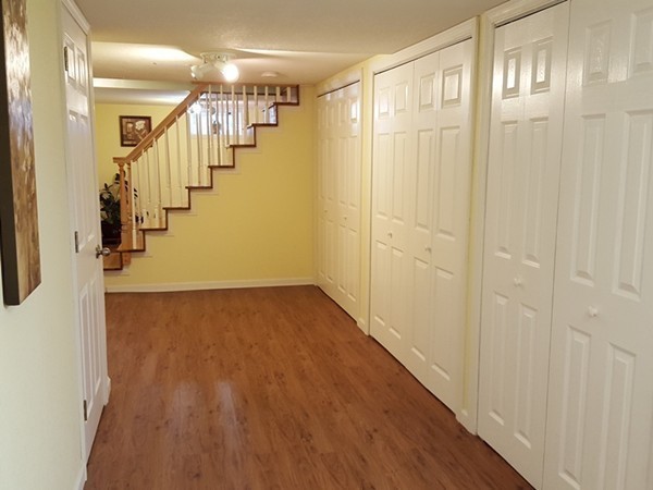 62 Corey Road Springfield, MA 01128 - Photo 17 of 26 a view of a hallway with wooden floor and staircase