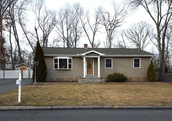 62 Corey Road Springfield, MA 01128 - Photo 26 of 26 a front view of house with yard and trees around