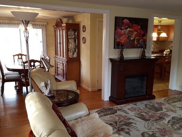 62 Corey Road Springfield, MA 01128 - Photo 5 of 26 a living room with furniture and a fireplace