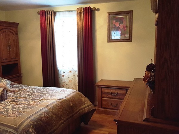 62 Corey Road Springfield, MA 01128 - Photo 10 of 26 a bedroom with a bed and a dresser