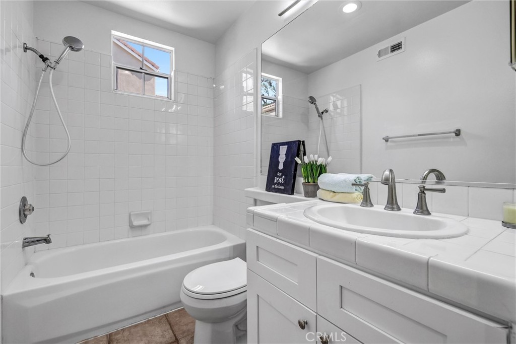 35 Del Cambrea Irvine, CA 92606 - Photo 14 of 31 a bathroom with a sink a toilet and a bathtub