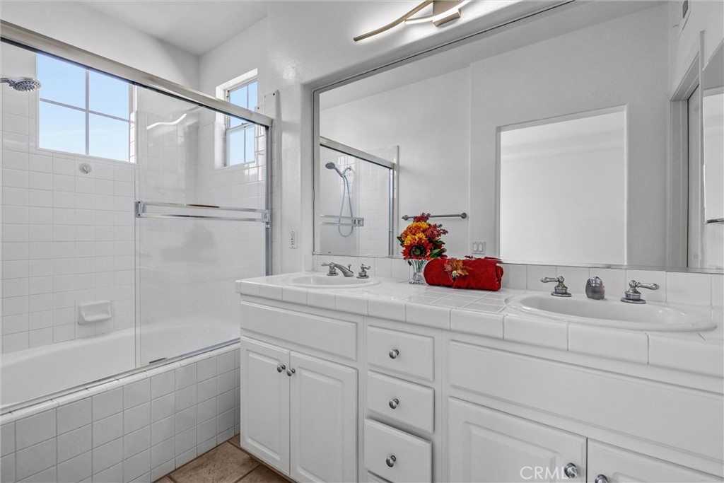 35 Del Cambrea Irvine, CA 92606 - Photo 19 of 31 a bathroom with a double vanity sink mirror and bathtub