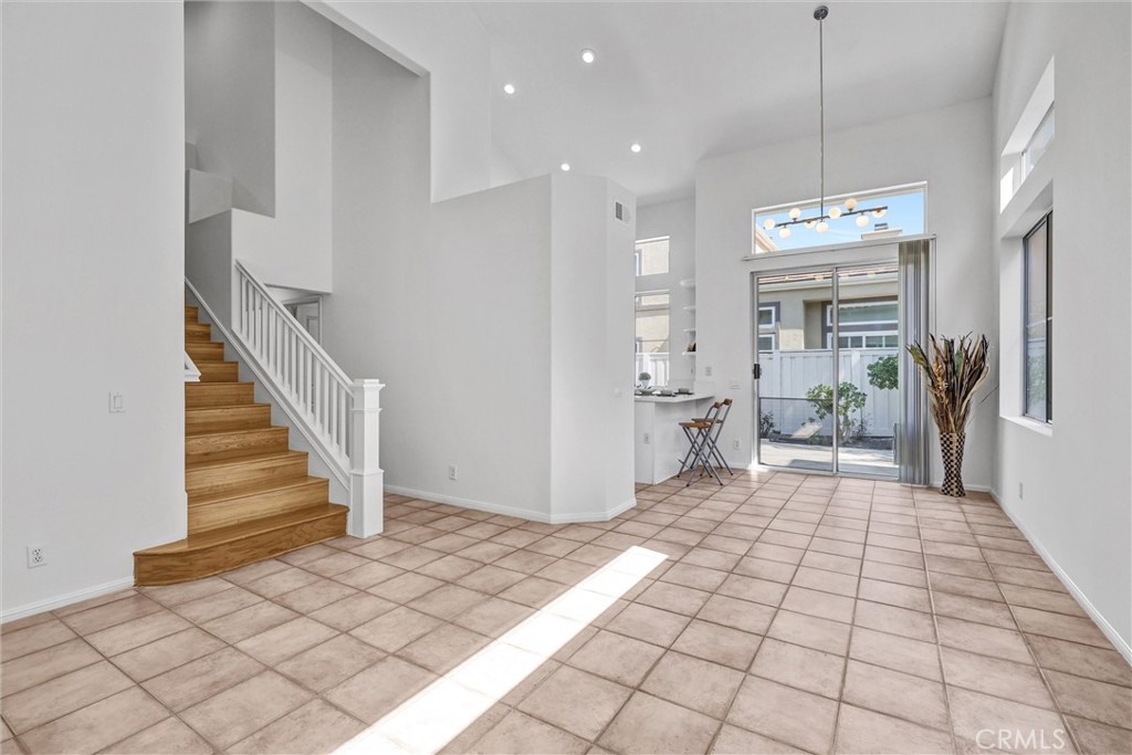 35 Del Cambrea Irvine, CA 92606 - Photo 4 of 31 a view of a hallway view with wooden floor and staircase