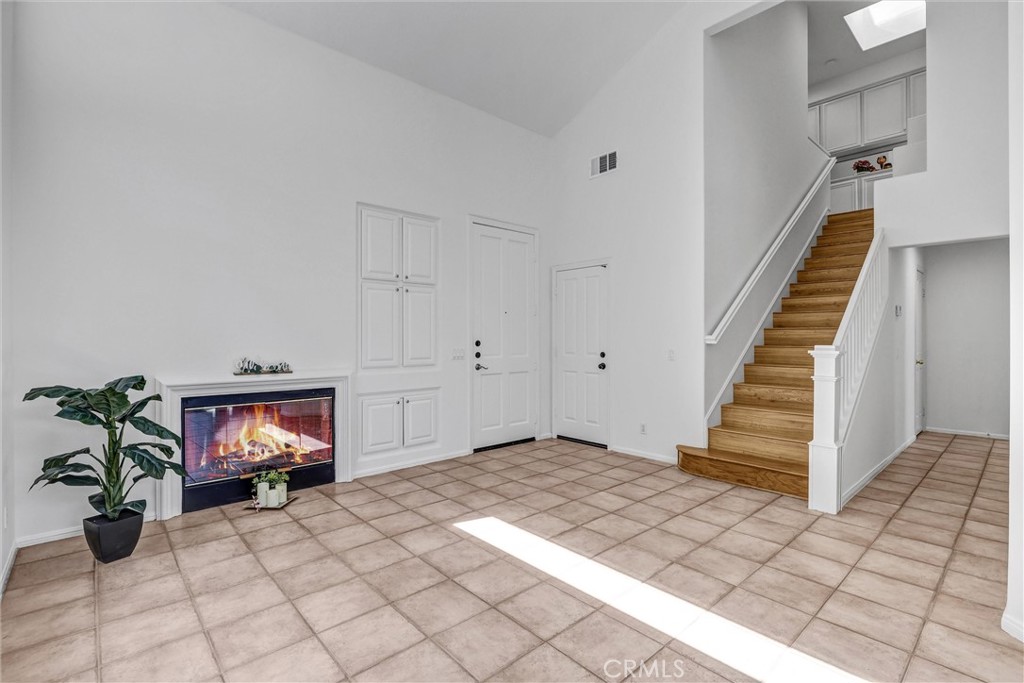 35 Del Cambrea Irvine, CA 92606 - Photo 5 of 31 a view of entryway with stairs and wooden floor