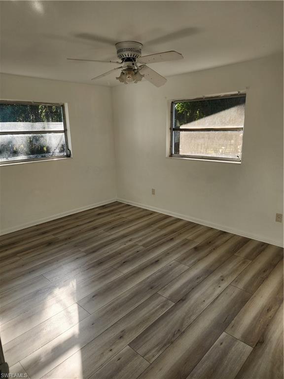 200 Willoughby Drive Naples, FL 34110 - Photo 11 of 15 Spare room featuring ceiling fan and dark wood-type flooring