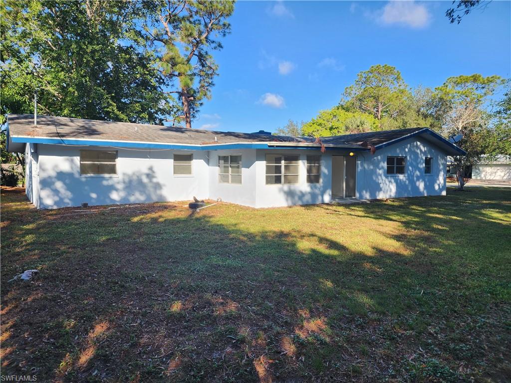 200 Willoughby Drive Naples, FL 34110 - Photo 15 of 15 Rear view of property featuring a yard