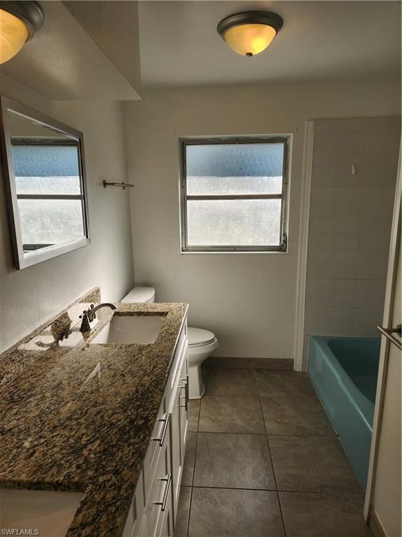 200 Willoughby Drive Naples, FL 34110 - Photo 10 of 15 Full bathroom featuring tile patterned flooring, vanity, toilet, and shower / bathing tub combination