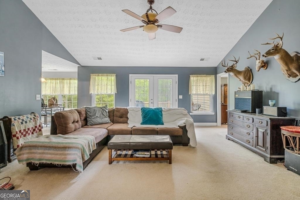 80 Upper Caldwell Road Bowdon, GA 30108 - Photo 4 of 33 a living room with furniture and a flat screen tv