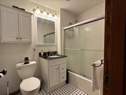 168 Wheatland Avenue, Unit 2 Chicopee, MA 01020 - Photo 12 of 15 a bathroom with a granite countertop sink toilet and shower