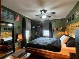 168 Wheatland Avenue, Unit 2 Chicopee, MA 01020 - Photo 9 of 15 a bedroom with a large bed and a chandelier