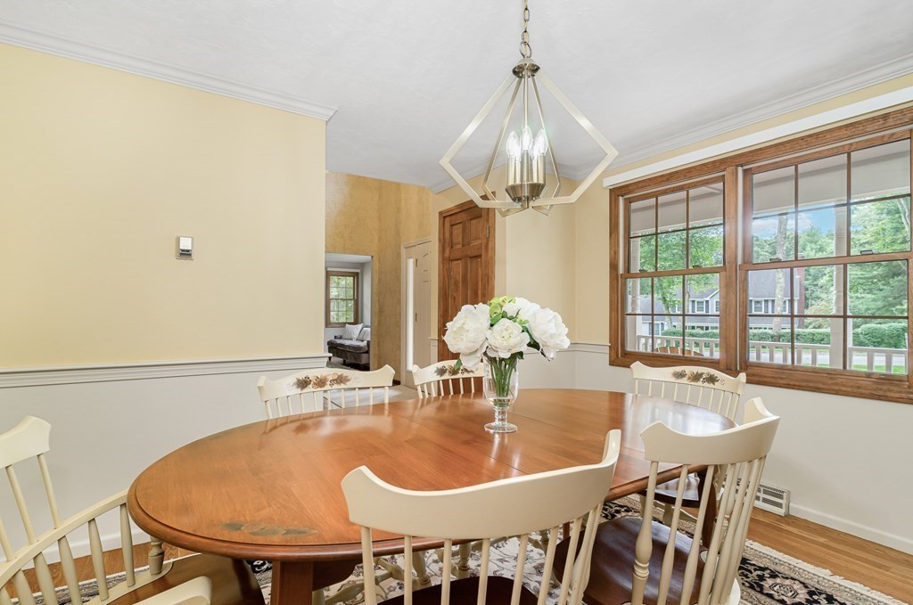 58 York Road Mansfield, MA 02048 - Photo 15 of 42 a dining room with furniture a chandelier and window