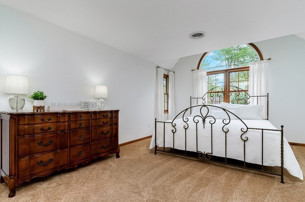 58 York Road Mansfield, MA 02048 - Photo 26 of 42 a large white bed sitting in a room next to a window