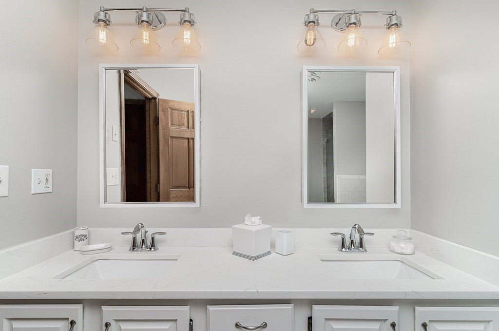 58 York Road Mansfield, MA 02048 - Photo 28 of 42 a bathroom with double vanity sinks and a mirror