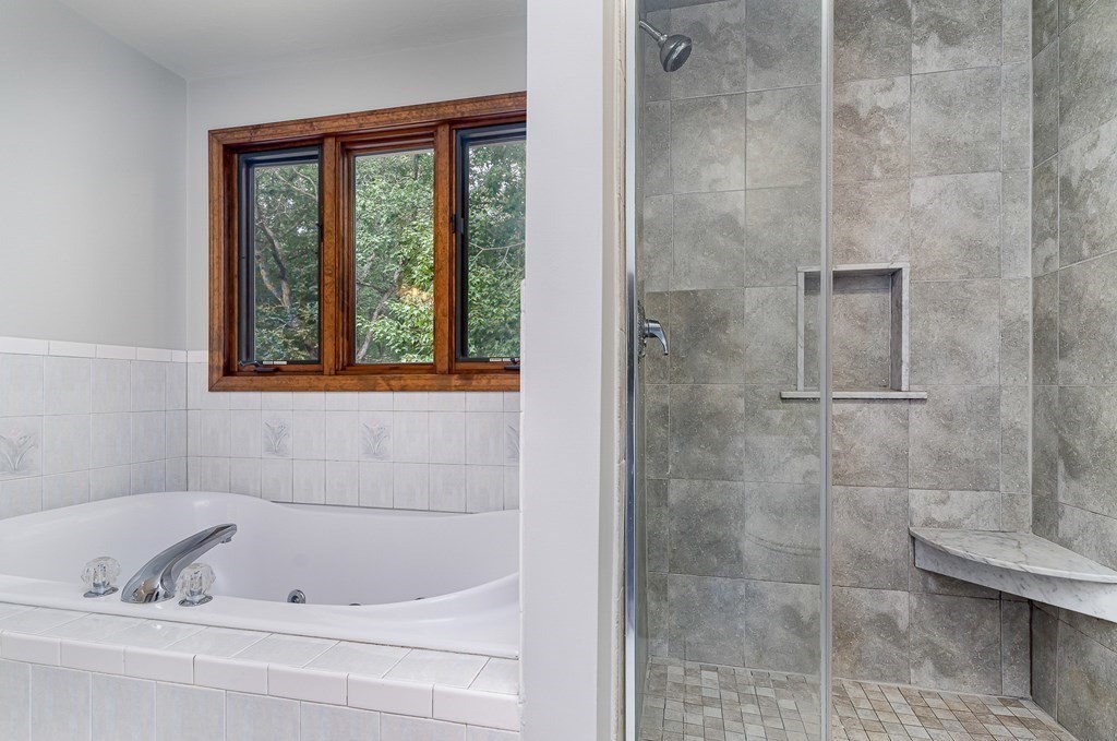 58 York Road Mansfield, MA 02048 - Photo 30 of 42 a bathroom with a bathtub and a shower