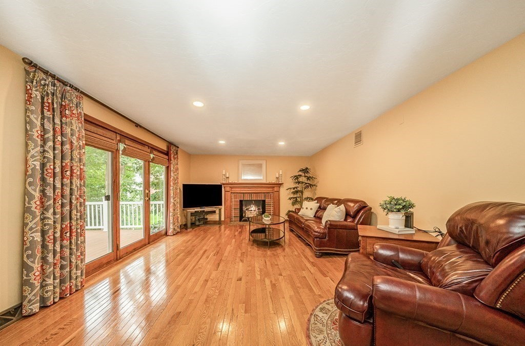 58 York Road Mansfield, MA 02048 - Photo 9 of 42 a living room with furniture and a flat screen tv