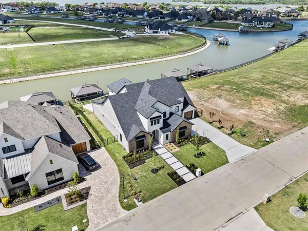 an aerial view of a house with a ocean view