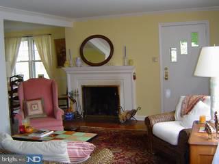228 Sunnybrook Road Flourtown, PA 19031 - Photo 3 of 6 a living room with furniture a window and a fireplace