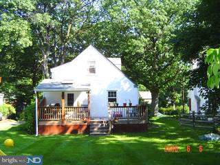 228 Sunnybrook Road Flourtown, PA 19031 - Photo 6 of 6 a view of a house with a yard deck and a large tree