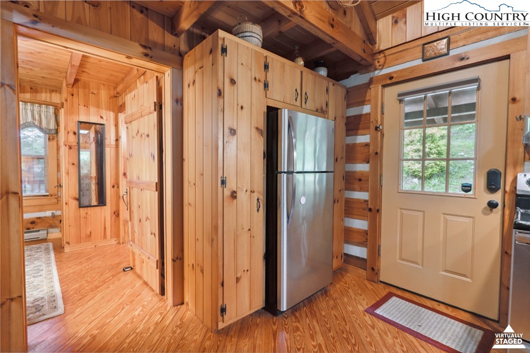 710 River Hills Road Lansing, NC 28643 - Photo 16 of 38 a view of an entryway with wooden floor and door