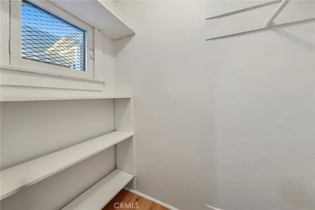 a view of small space with racks on the wall