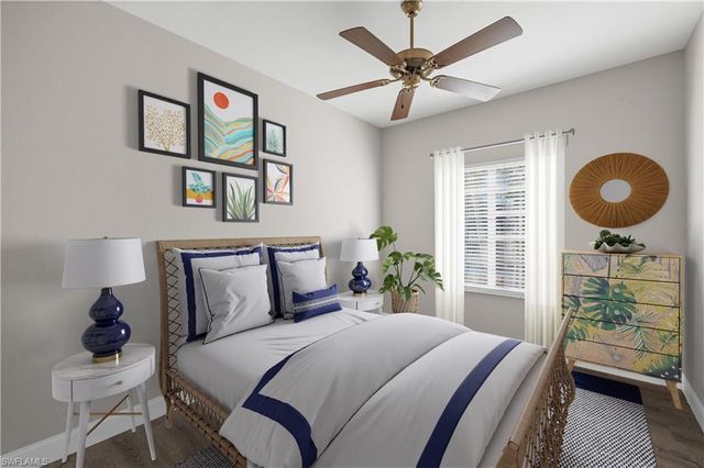 a bathroom with a granite countertop sink and a mirror with toilet