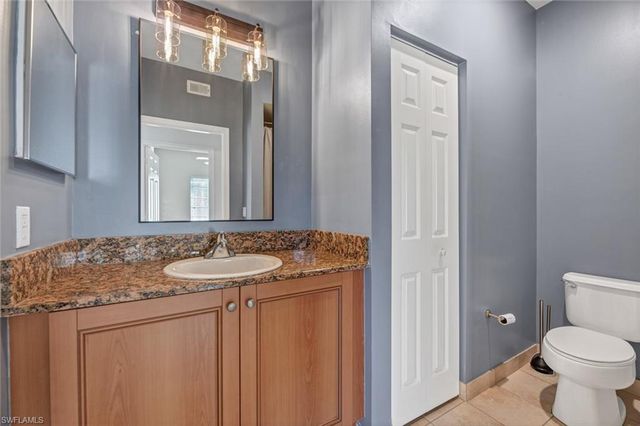 a bathroom with a toilet and a shower curtain