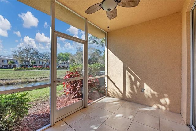 a view of a room with a floor to ceiling window and swing