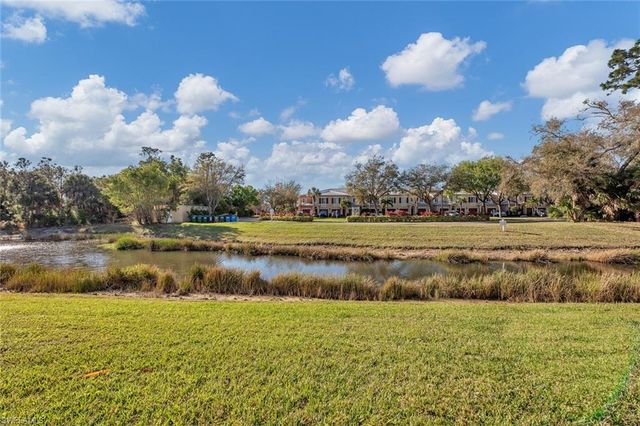 a view of a house with swimming pool and sitting area