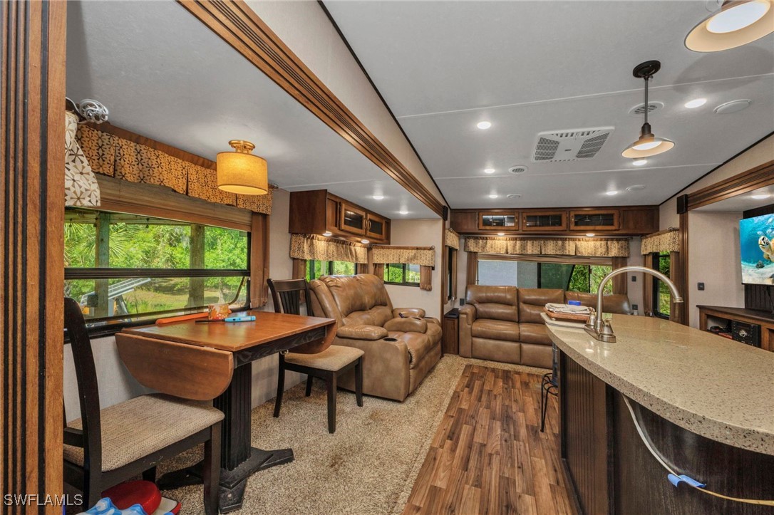 1269 Northwest Peace Pointe Drive Arcadia, FL 34266 - Photo 13 of 21 a living room with furniture and a large window