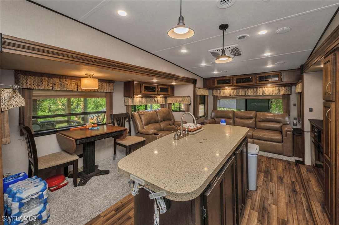 1269 Northwest Peace Pointe Drive Arcadia, FL 34266 - Photo 14 of 21 a large kitchen with a table and a stove