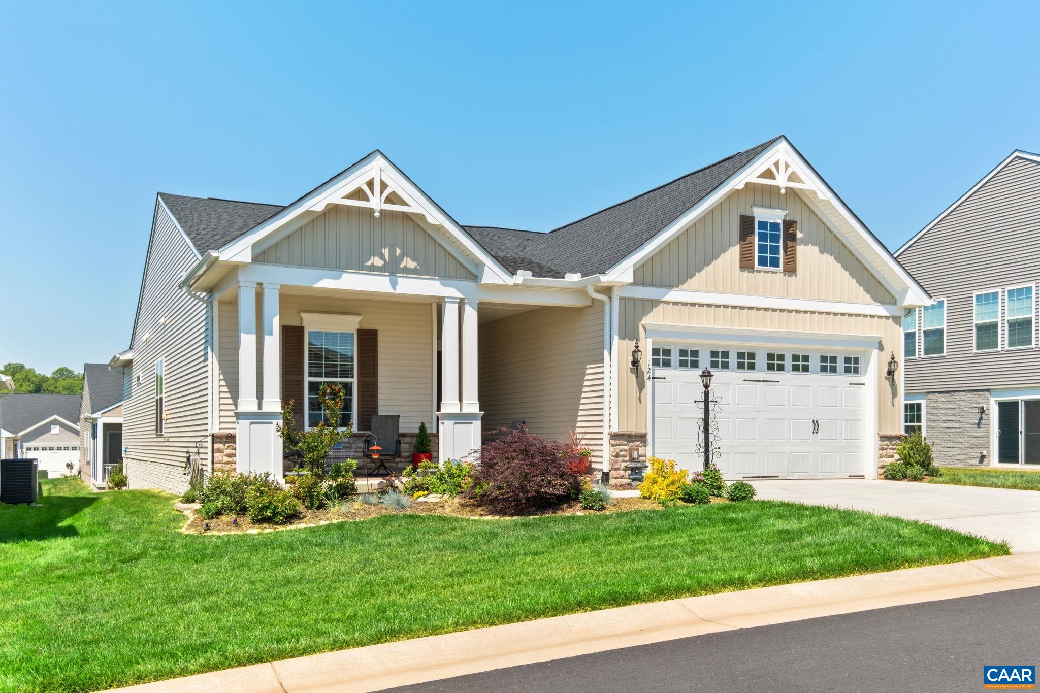 124 Stodghill Drive Ruckersville, VA 22968 - Photo 1 of 58 a front view of a house with a yard and garage