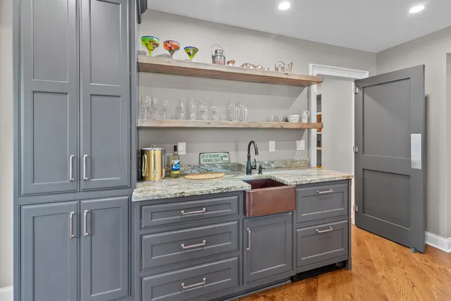 a kitchen with granite countertop cabinets and stainless steel appliances