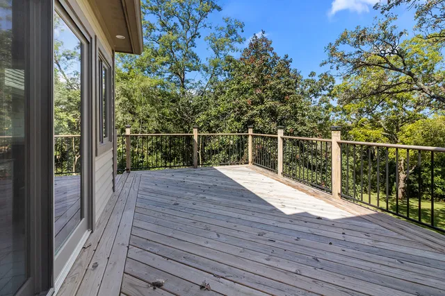 a view of a balcony with wooden floor