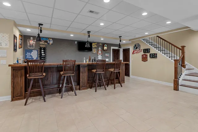 a room with furniture and wall paintings