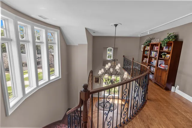 a spacious bathroom with a double vanity sink a mirror and a shower
