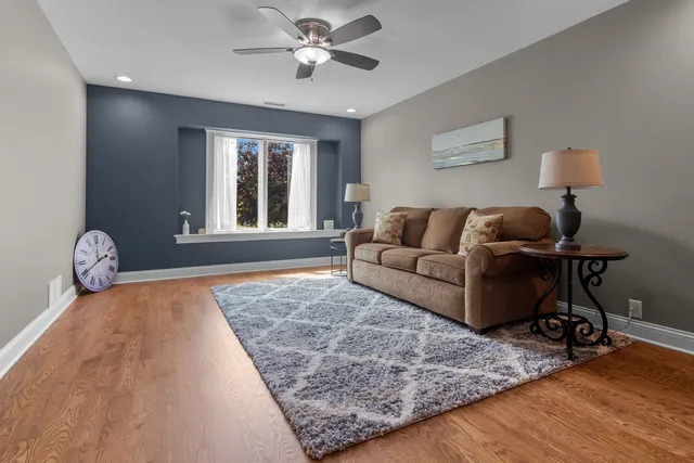 a bathroom with a tub a double vanity sink and a large mirror