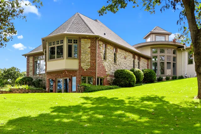 a view of a dining room with furniture large windows and wooden floor