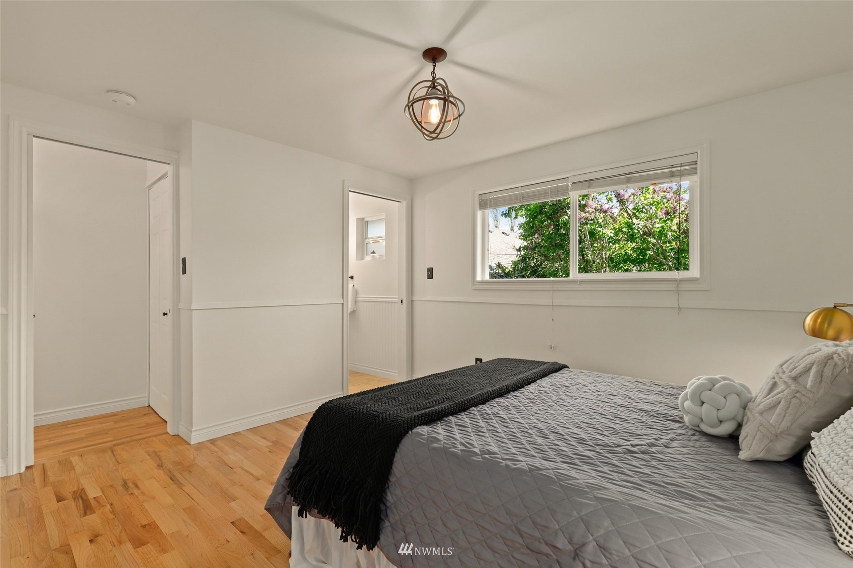 8817 37th Avenue Southwest Seattle, WA 98126 - Photo 20 of 40 a bedroom with a bed and a window