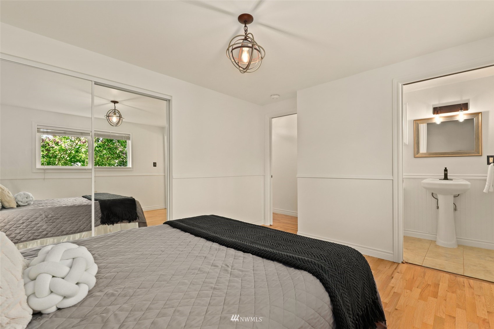 8817 37th Avenue Southwest Seattle, WA 98126 - Photo 21 of 40 a bedroom with a bed and window