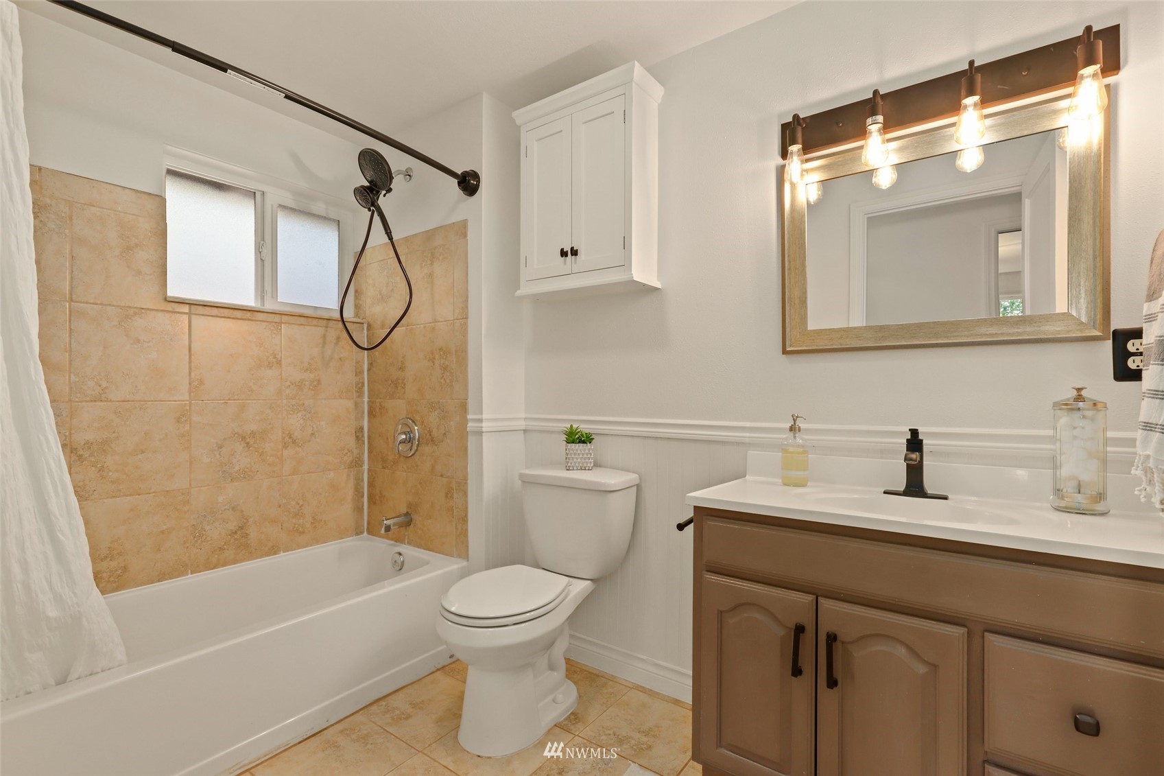 8817 37th Avenue Southwest Seattle, WA 98126 - Photo 26 of 40 a bathroom with a sink toilet and shower
