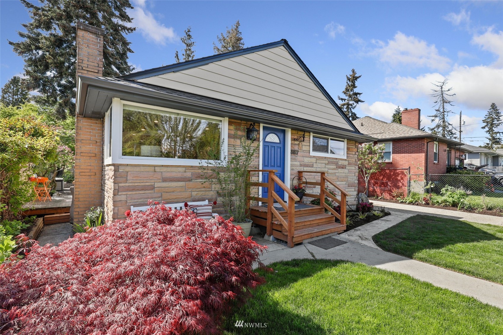 8817 37th Avenue Southwest Seattle, WA 98126 - Photo 38 of 40 front view of a house with a garden
