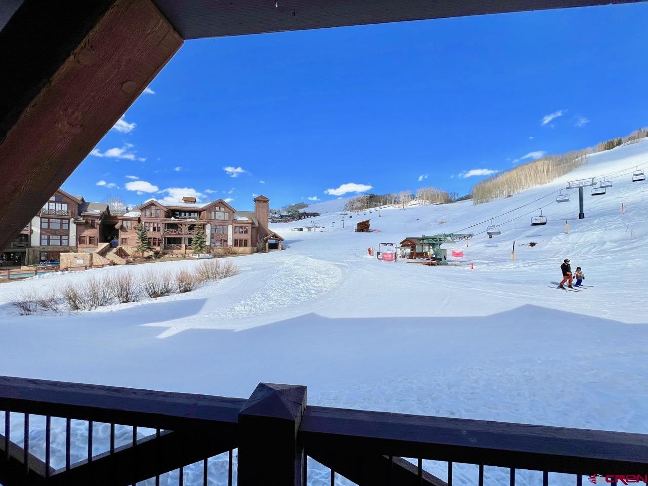 14 Hunter Hill Road, Unit C203 Crested Butte, CO 81225 - Photo 20 of 34 a kitchen with a table and chairs