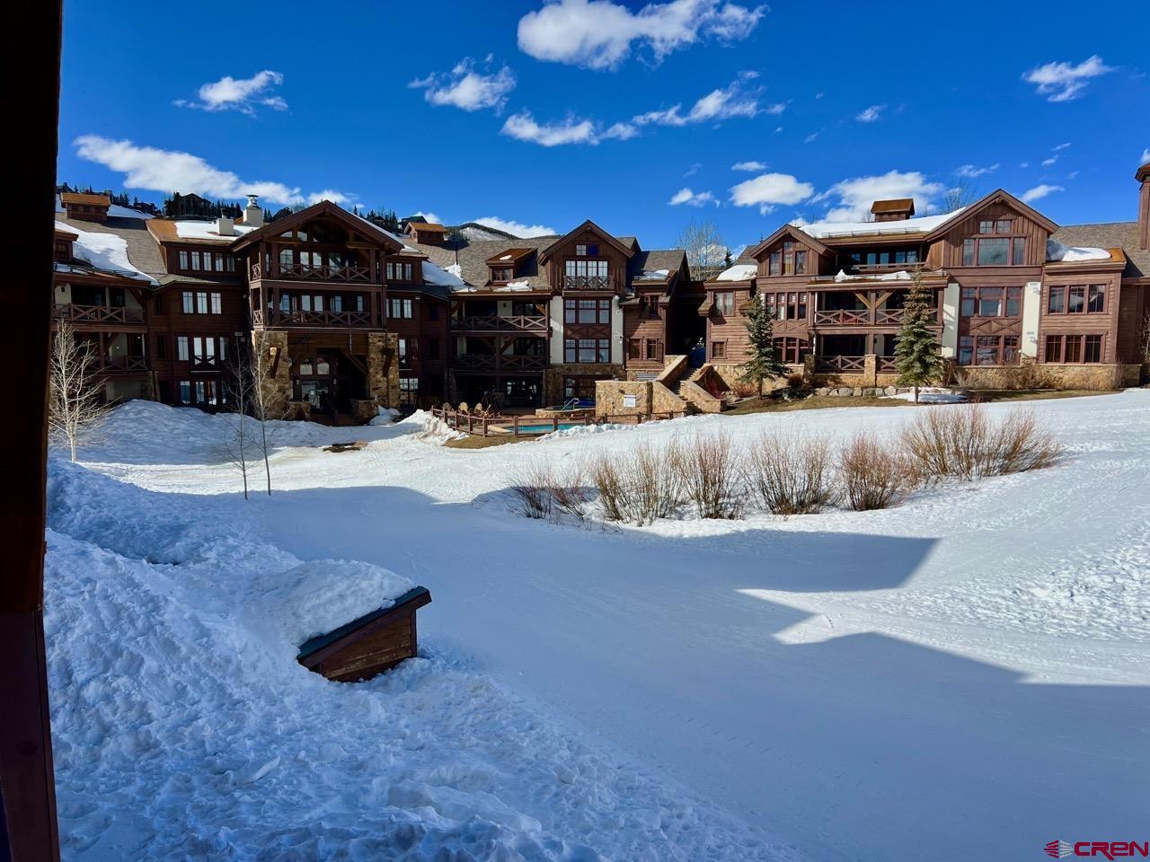 14 Hunter Hill Road, Unit C203 Crested Butte, CO 81225 - Photo 21 of 34 a view of a large house with a yard